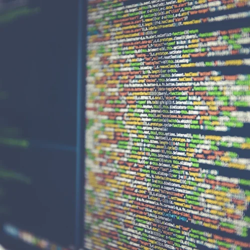 Colourful programming code displayed on a computer monitor.