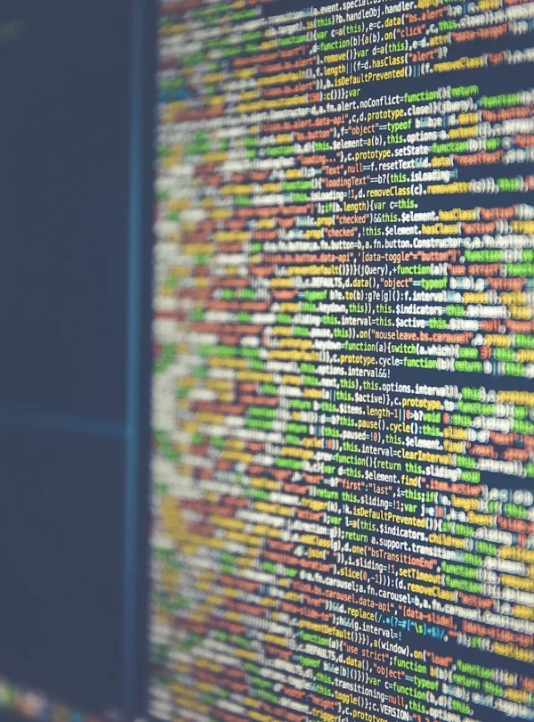 Colourful programming code displayed on a computer monitor.