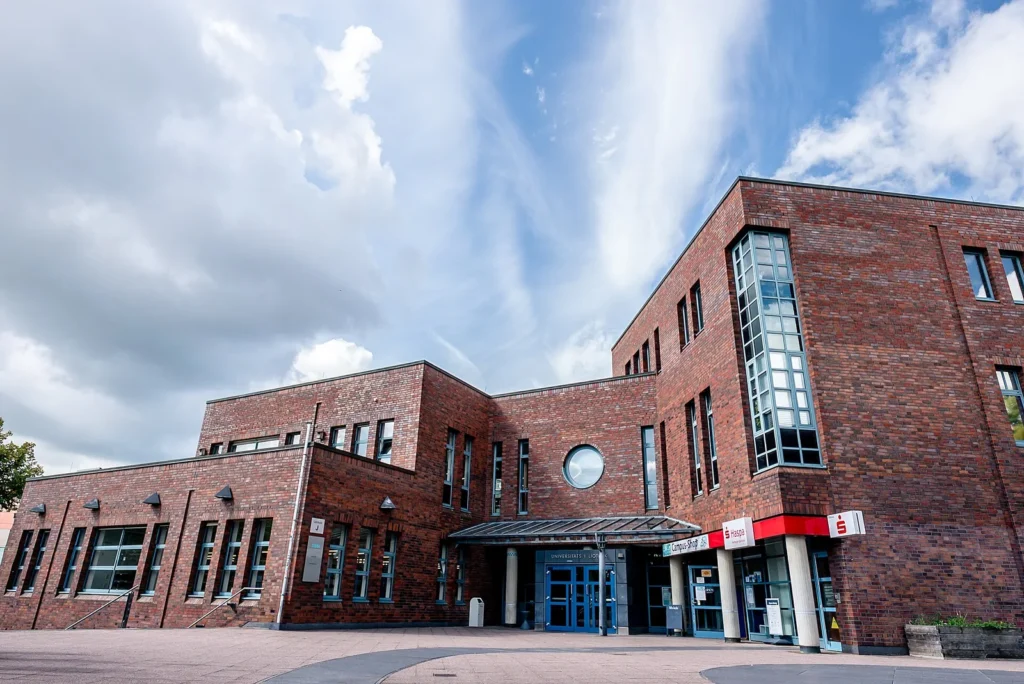 Brick university library exterior, shown as an illustrative academic setting.