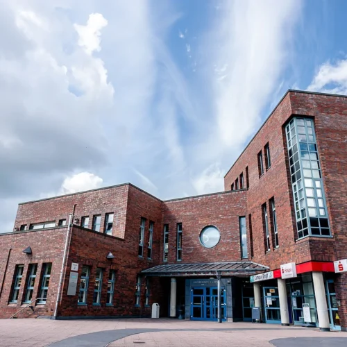 Brick university library exterior, shown as an illustrative academic setting.