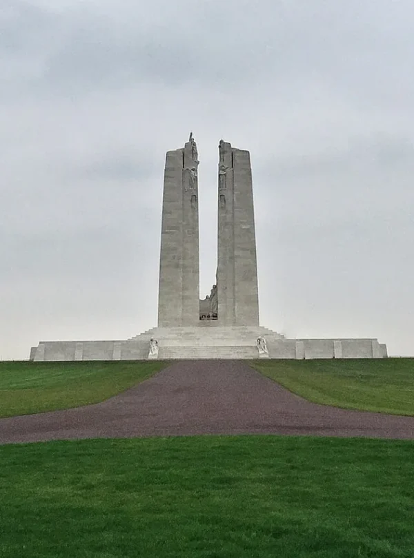 Twin stone pylons of the Canadian National Vimy Memorial above the landscaped grounds.